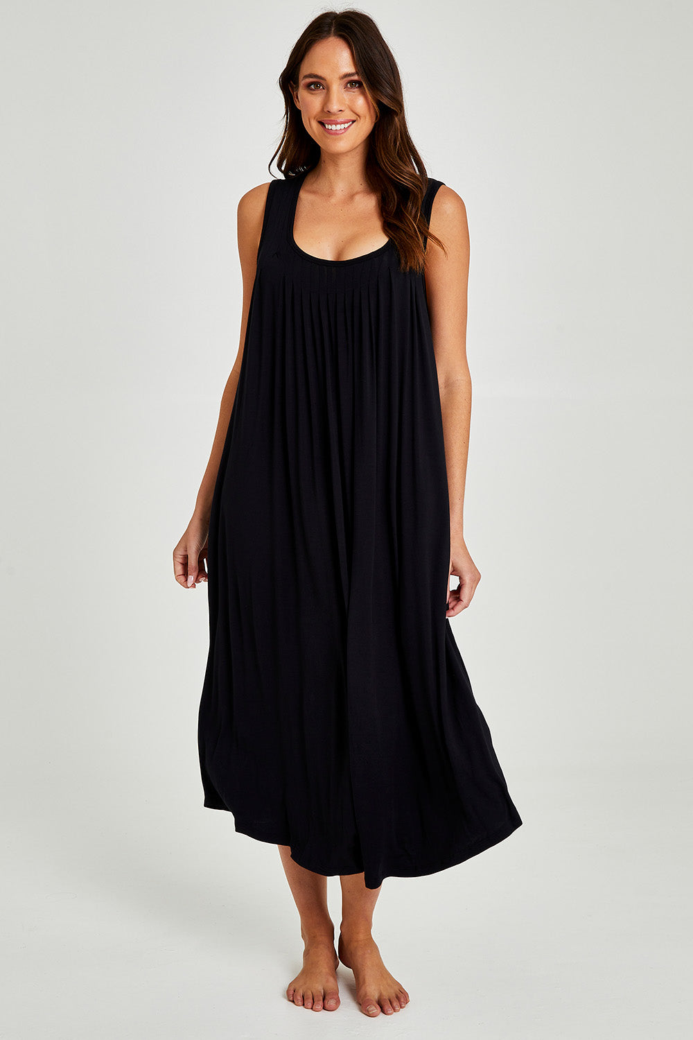 Model Madeline wearing size S of the Kate Modal Soft Pleat Front Maxi Nightie in colour Black (Black), from the front, showing the whole outfit