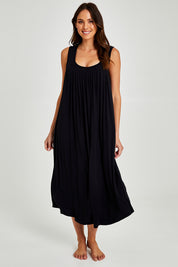 Model Madeline wearing size S of the Kate Modal Soft Pleat Front Maxi Nightie in colour Black (Black), from the front, showing the whole outfit