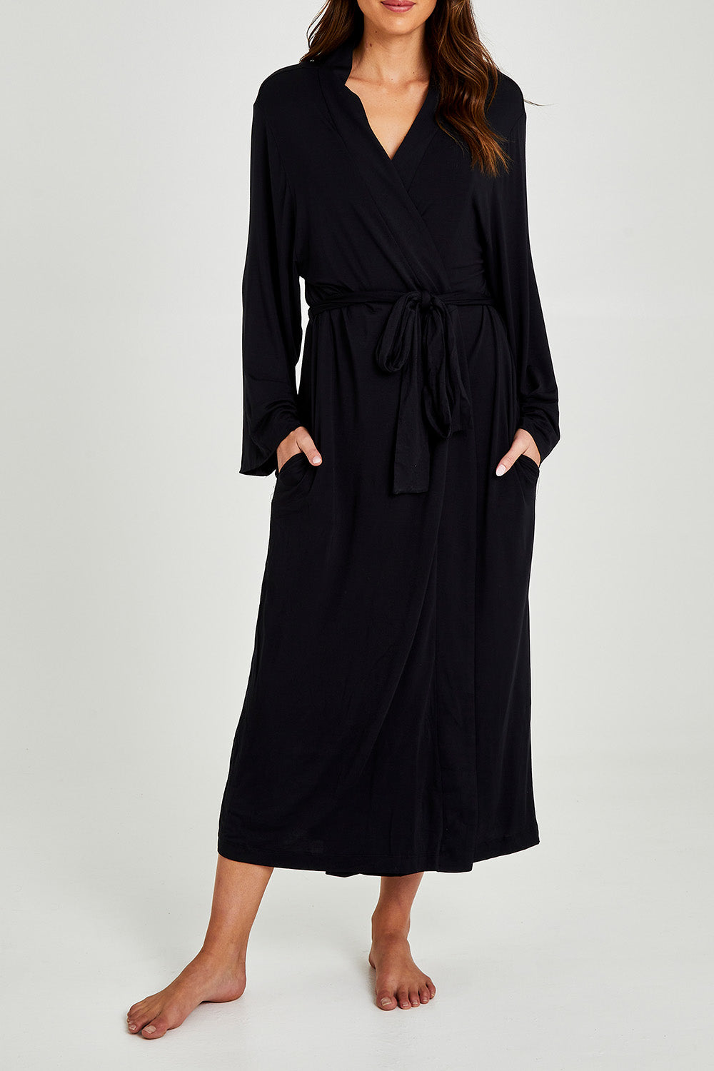 Model Madeline wearing size S of the Kate Modal Soft Maxi Robe in colour Black (Black), from the front, cropped image