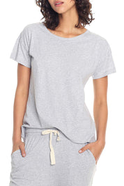 A model wearing the Jada Organic Cotton Knit Tee in colour Grey (Grey), from the front, cropped image