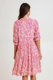 Model Madeline wearing size S of the Short Shirt Dress in colour Seafusc (Pink), from the back
