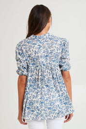 Model Madeline wearing size S of the Cotton Flowy Top in colour Blue (Blue), from the back