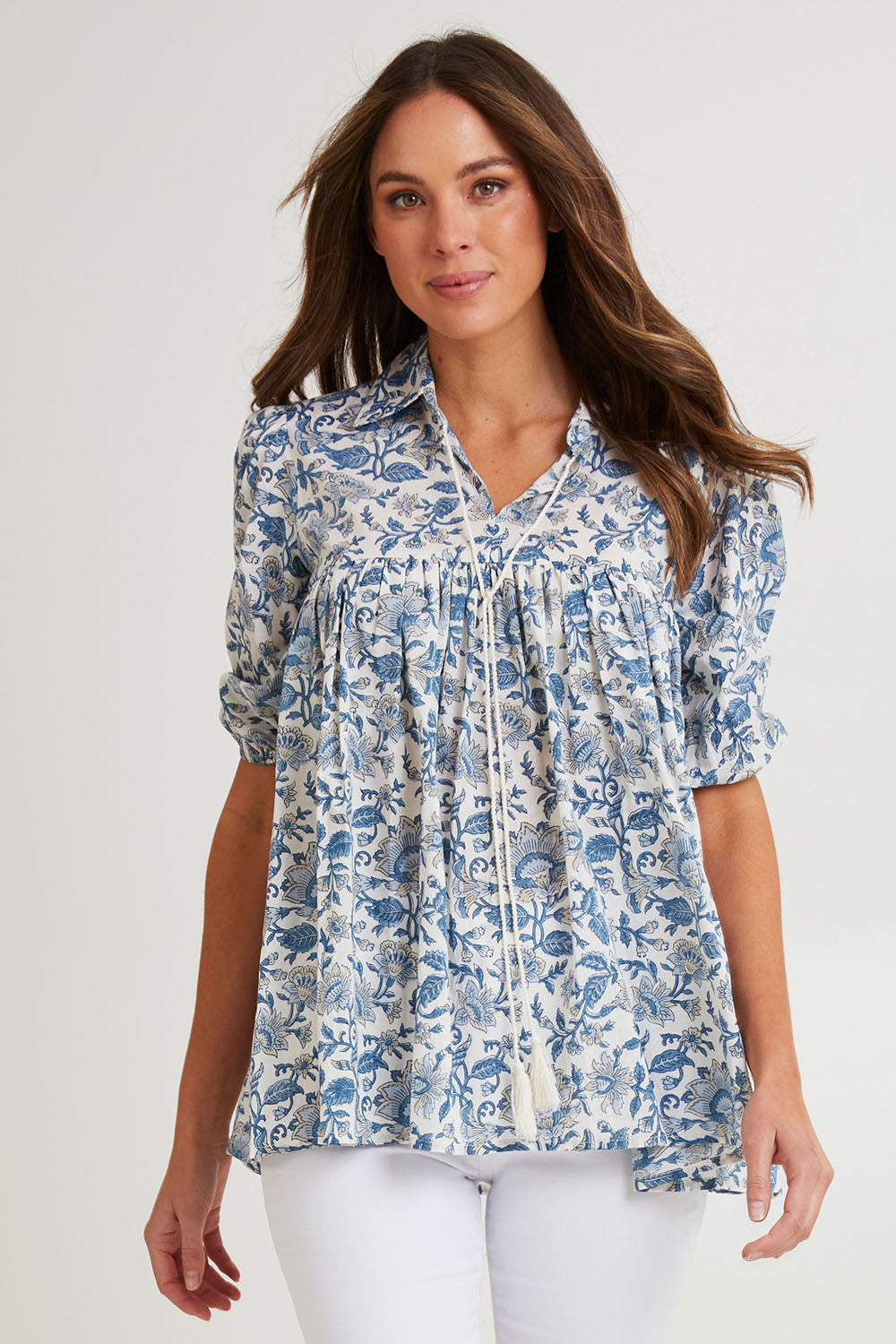 Model Madeline wearing size S of the Cotton Flowy Top in colour Blue (Blue), from the front, cropped image