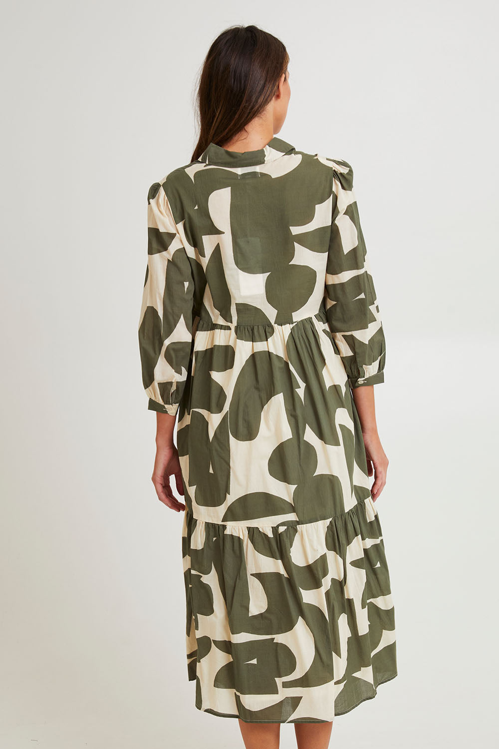 Model Madeline wearing size S of the Cotton Shirt Dress in colour Khakikool (Green), from the back