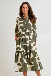 Model Madeline wearing size S of the Cotton Shirt Dress in colour Khakikool (Green), from the front, cropped image