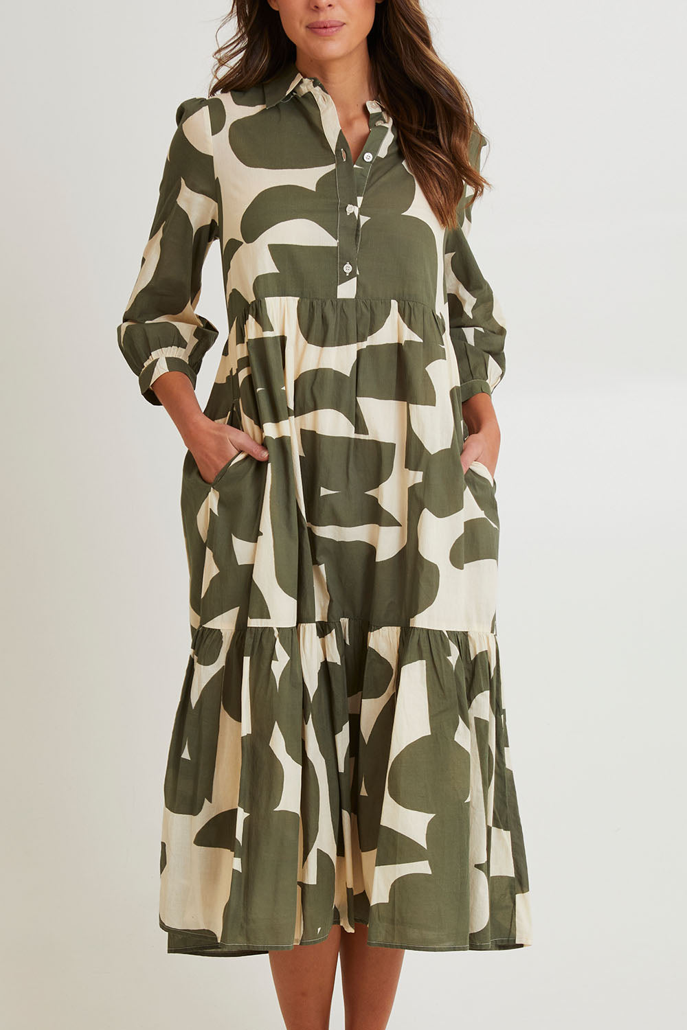 Model Madeline wearing size S of the Cotton Shirt Dress in colour Khakikool (Green), from the front, cropped image