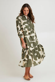 Model Madeline wearing size S of the Cotton Shirt Dress in colour Khakikool (Green), from the front, showing the whole outfit