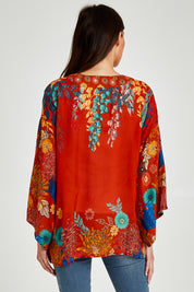 Model Madeline wearing size OneSize of the Kimono Jacket in colour Terracotta, from the back
