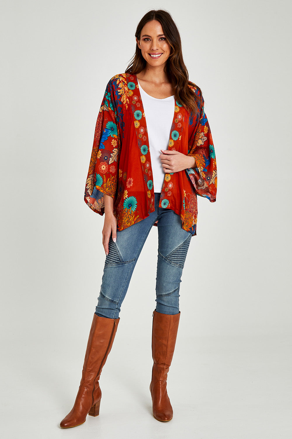 Model Madeline wearing size OneSize of the Kimono Jacket in colour Terracotta, from the front, showing the whole outfit