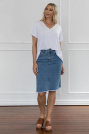 A model wearing the Frayed Denim Skirt in colour Blue (Blue), from the front, showing the whole outfit