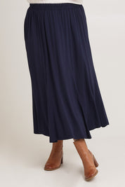 Model Chanel wearing size XL of the Adeline Bamboo Skirt in colour Navy (Blue), from the front, cropped image