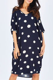 Model Gemma wearing the Woven Miracle Dress in colour SugarSpot (Blue), from the front, cropped image