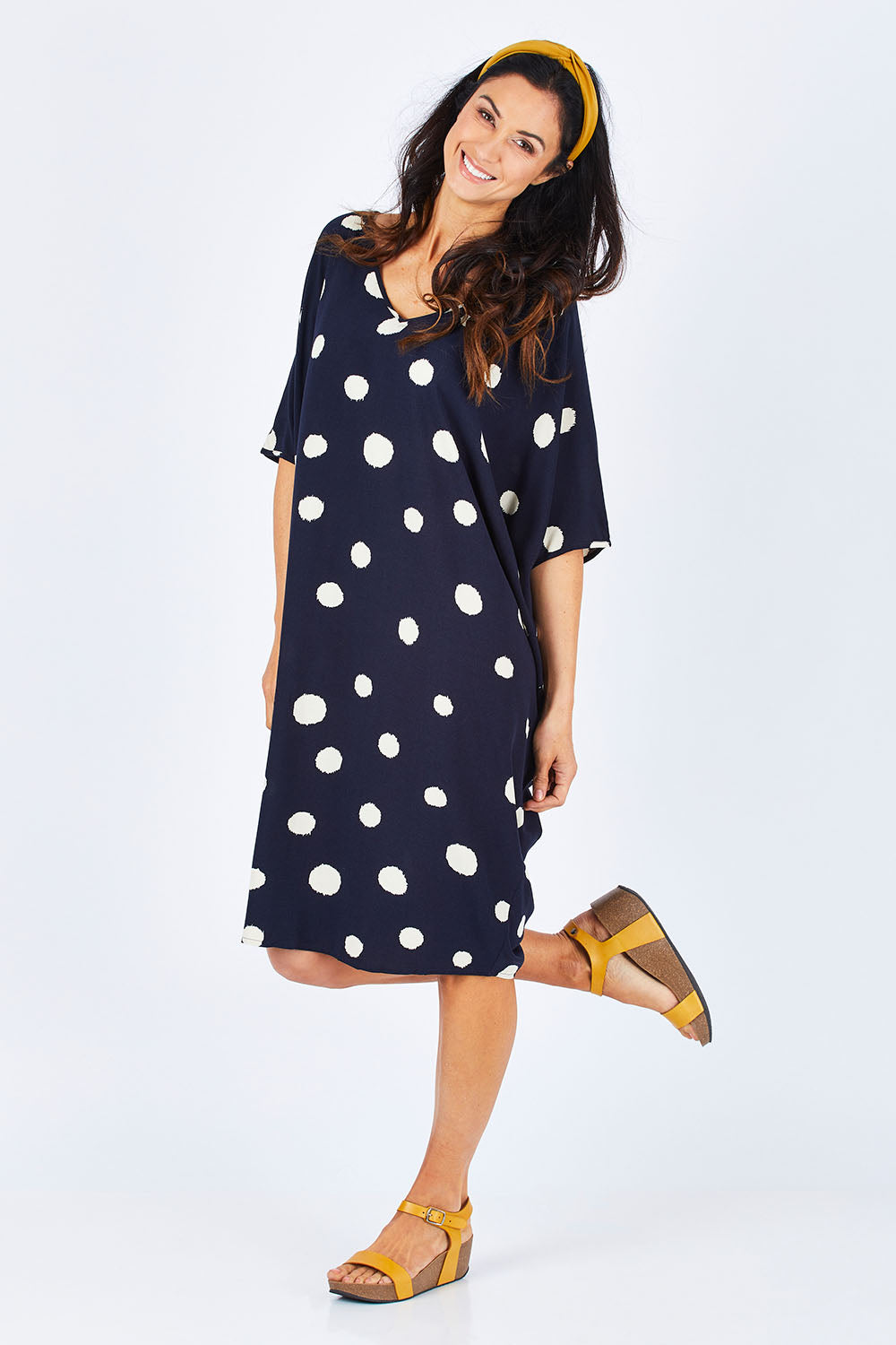 Model Gemma wearing the Woven Miracle Dress in colour SugarSpot (Blue), from the front, showing the whole outfit