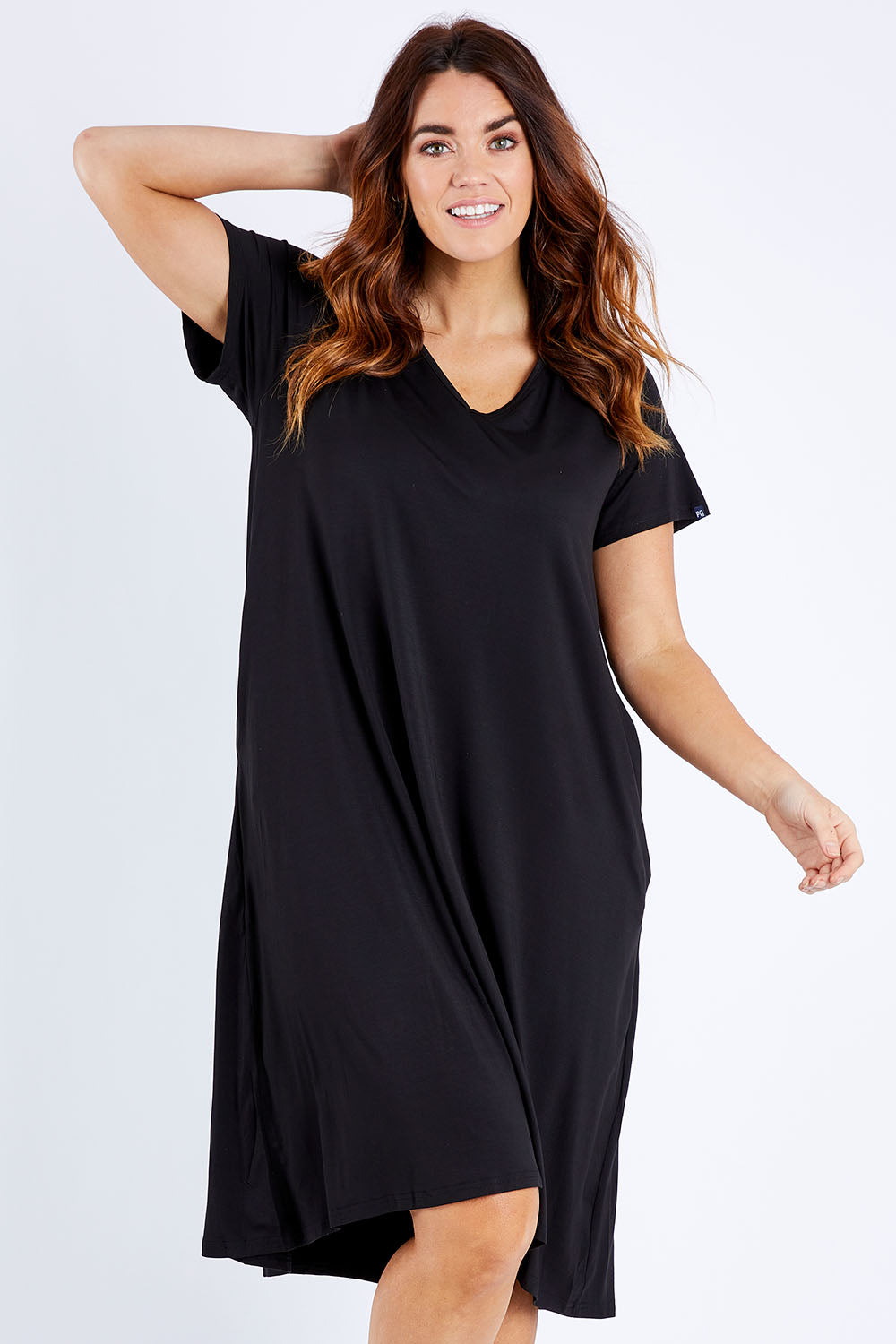 Model Laura wearing the Tin colourShirt Dress - Black (Black), from the front, cropped image