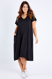 Model Laura wearing the Tin colourShirt Dress - Black (Black), from the front, showing the whole outfit