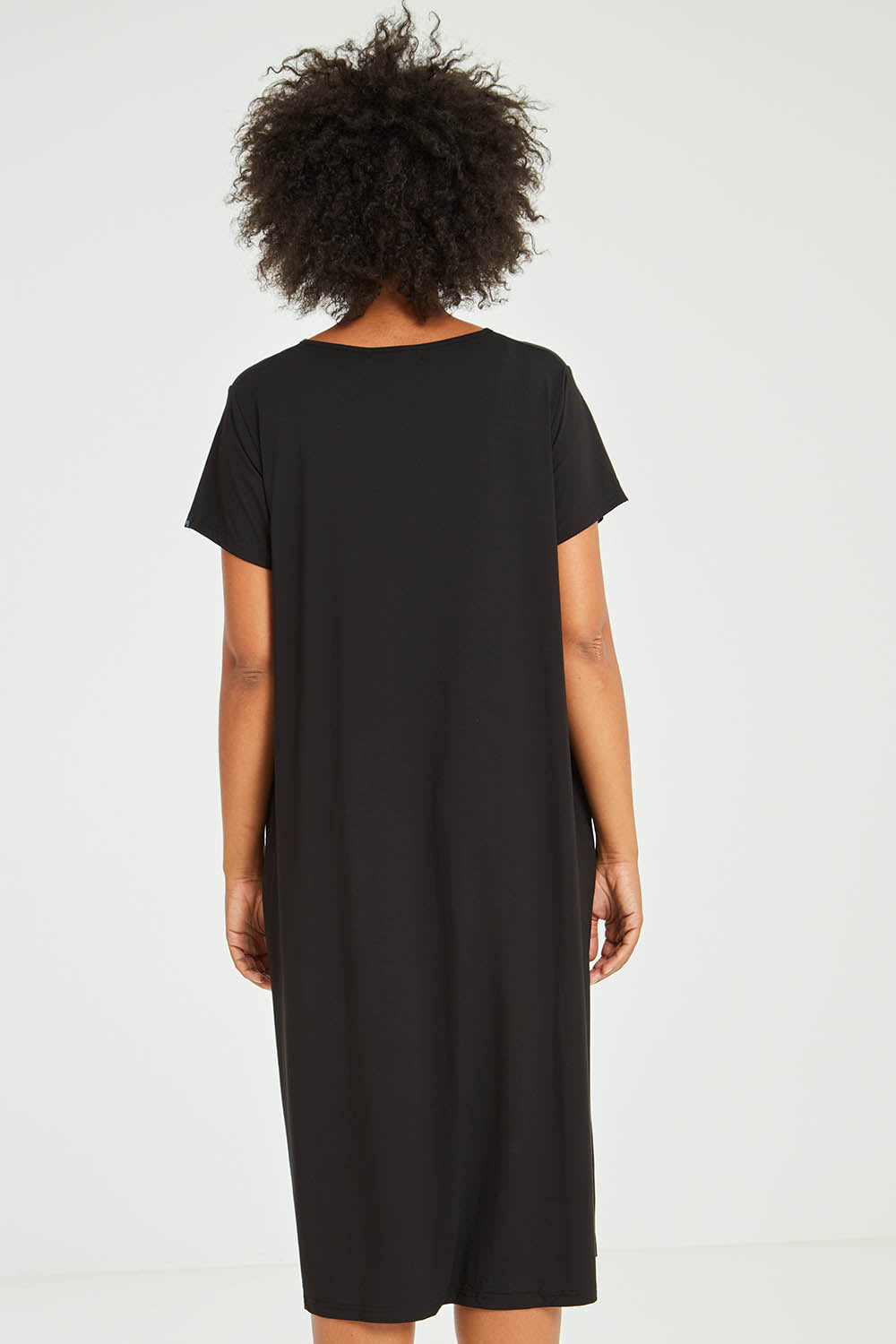 Model Olivia wearing the Tin colourShirt Dress - Black (Black), from the back