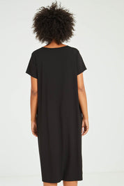 Model Olivia wearing the Tin colourShirt Dress - Black (Black), from the back