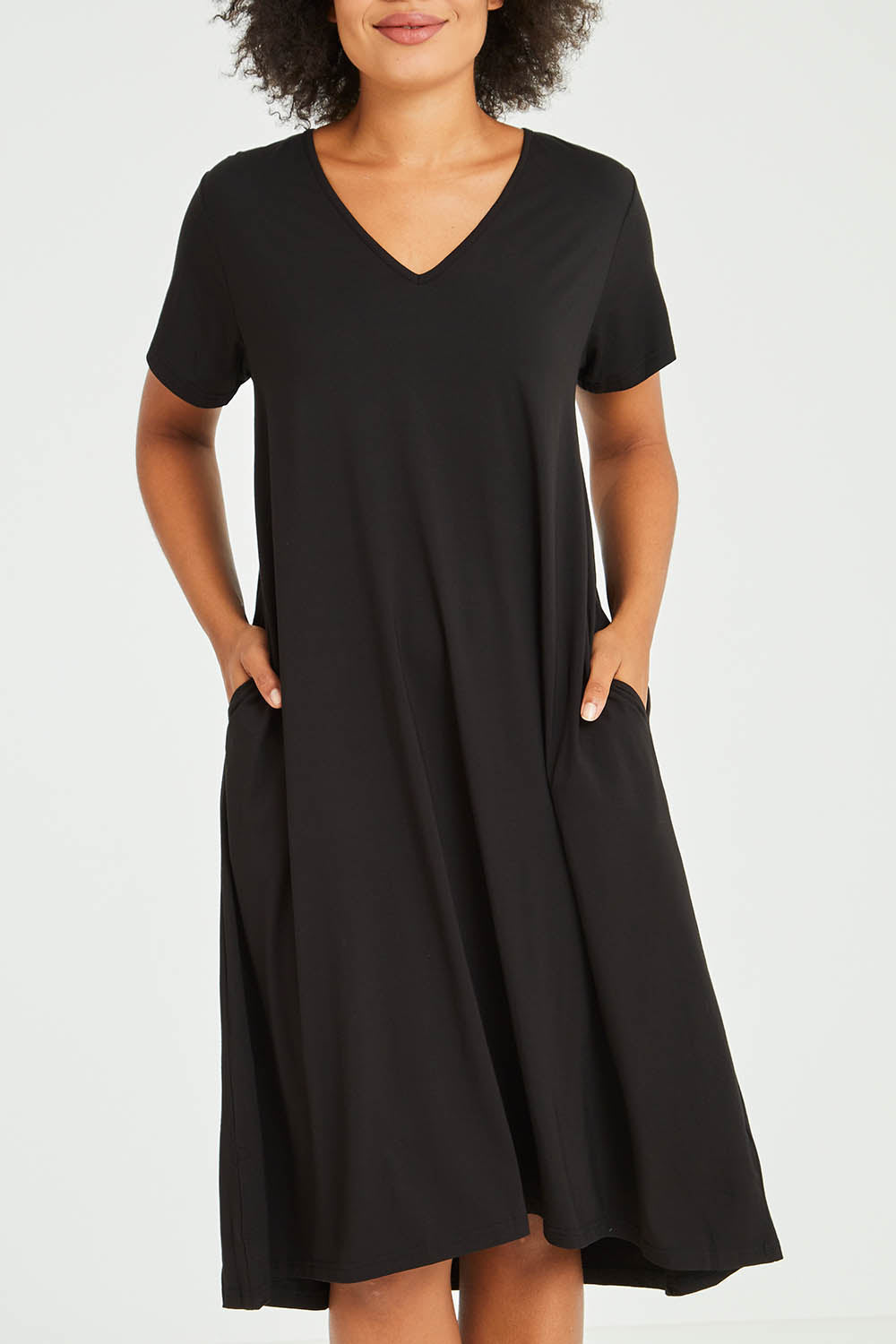 Model Olivia wearing the Tin colourShirt Dress - Black (Black), from the front, cropped image