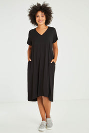 Model Olivia wearing the Tin colourShirt Dress - Black (Black), from the front, showing the whole outfit