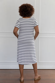 A model wearing the Tin colourShirt Dress - Stripe (White), from the back