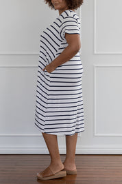 A model wearing the Tin colourShirt Dress - Stripe (White), from the front, cropped image