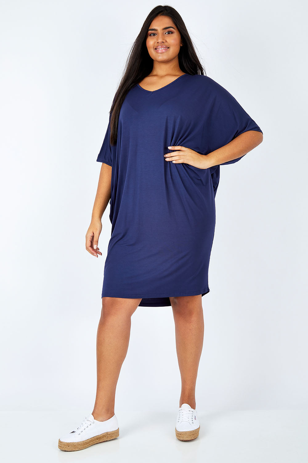 Model Shanaya wearing size OneSize of the Original Miracle Dress in colour Navy (Blue), from the front, showing the whole outfit