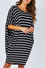 Model Madeline wearing size OneSize of the Stripe Original Miracle Dress in colour BlackWhite (Black), from the front, cropped image
