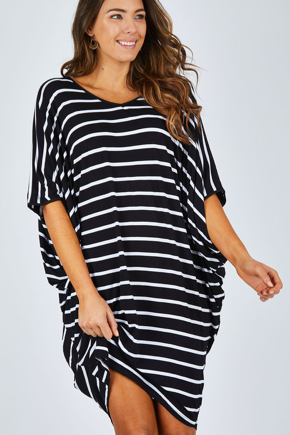 Model Madeline wearing size OneSize of the Stripe Original Miracle Dress in colour BlackWhite (Black), from the front, cropped image