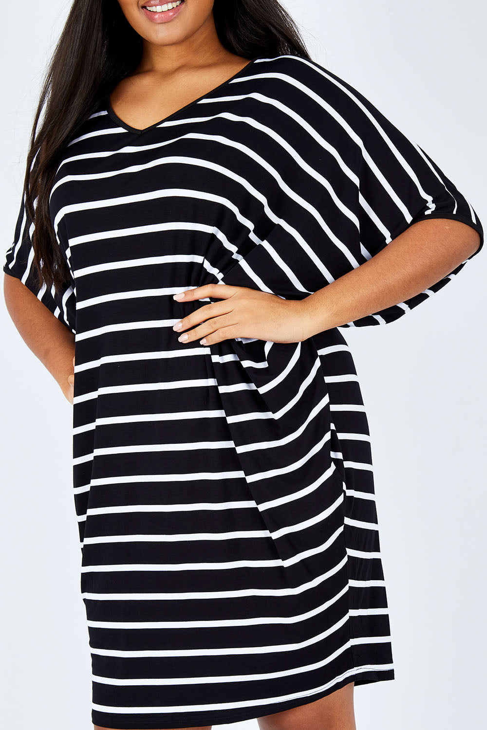 Model Shanaya wearing size OneSize of the Stripe Original Miracle Dress in colour BlackWhite (Black), from the front, cropped image