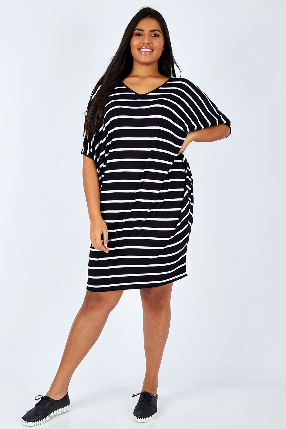 Model Shanaya wearing size OneSize of the Stripe Original Miracle Dress in colour BlackWhite (Black), from the front, showing the whole outfit