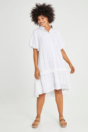 Model Olivia wearing the Petra Cotton Dress in colour White (White), from the front, showing the whole outfit