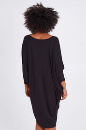 Model Olivia wearing size OneSize of the Long Sleeve Miracle Dress in colour Black (Black), from the back