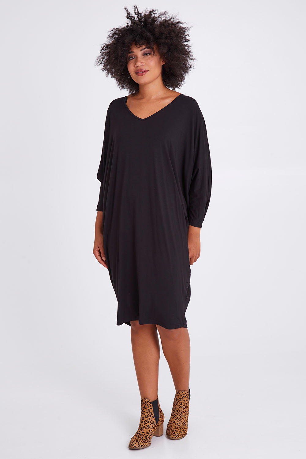 Model Olivia wearing size OneSize of the Long Sleeve Miracle Dress in colour Black (Black), from the front, showing the whole outfit