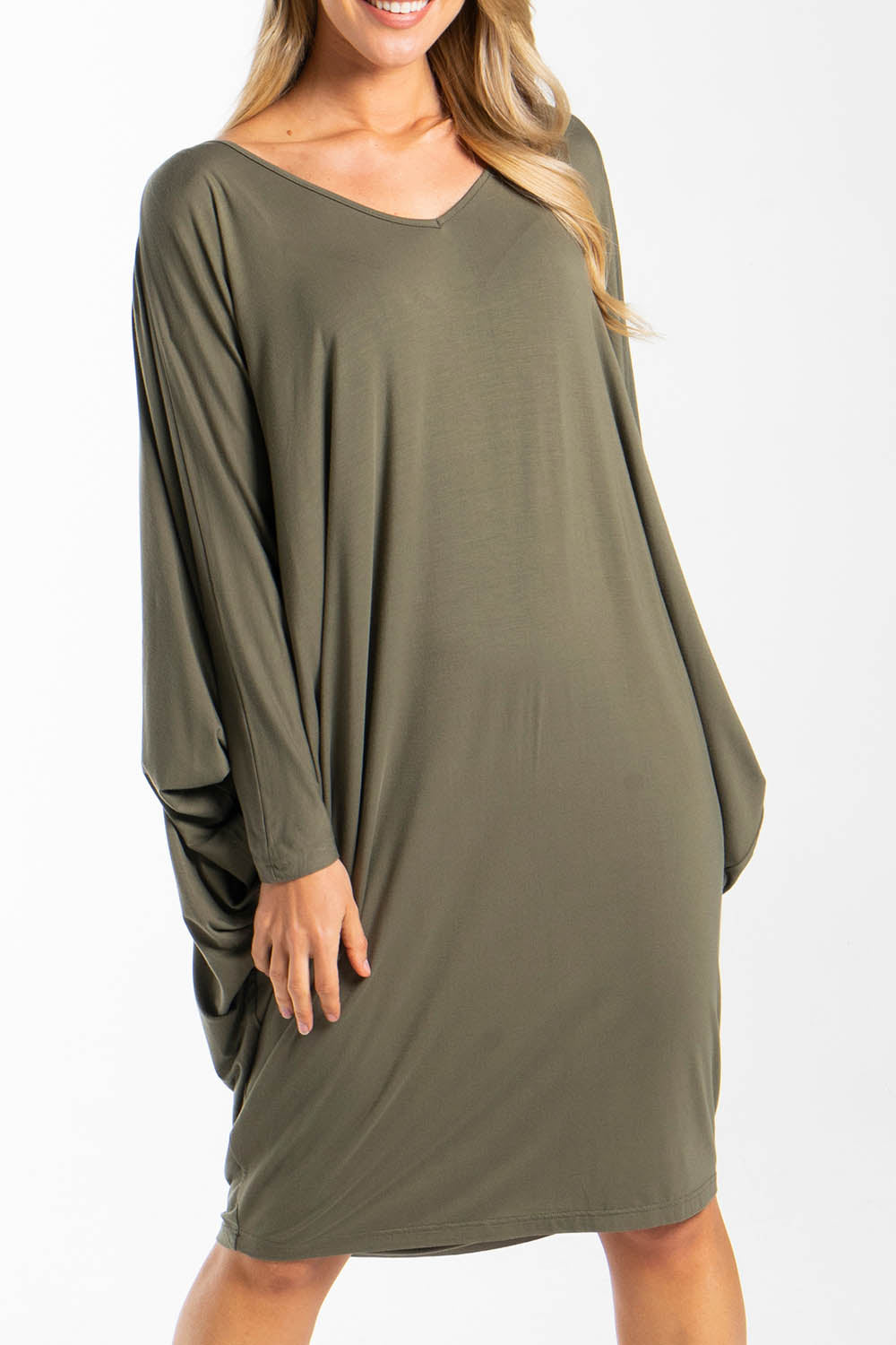 A model wearing the Long Sleeve Miracle Dress in colour Khaki (Green), from the front, cropped image