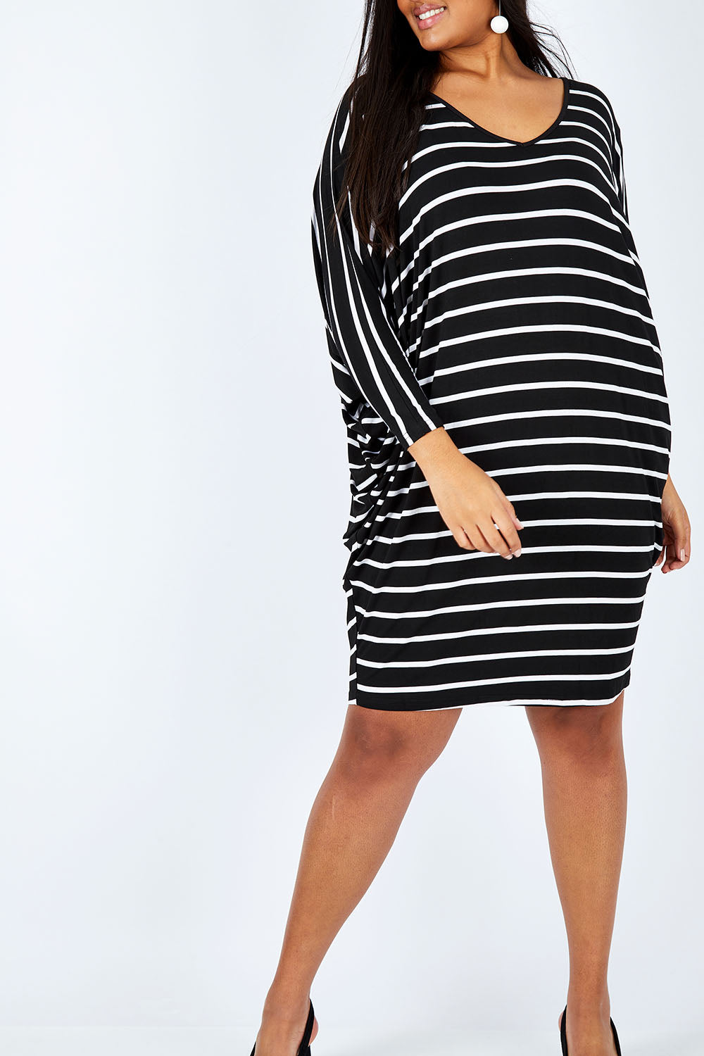 Model Shanaya wearing size OneSize of the Long Sleeve Stripe Miracle Dress in colour BlackWhite (Black), from the front, cropped image