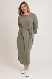 Model Chanel wearing size XL of the Mallory Bamboo Dress in colour Fern (Green), from the front, showing the whole outfit