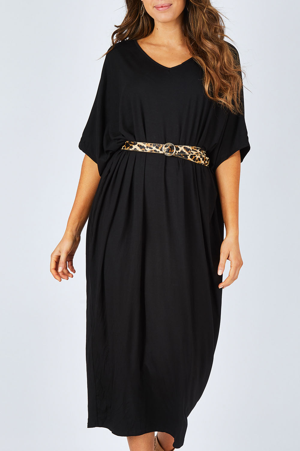 Model Madeline wearing size OneSize of the Maxi Miracle Dress in colour Black (Black), from the front, cropped image