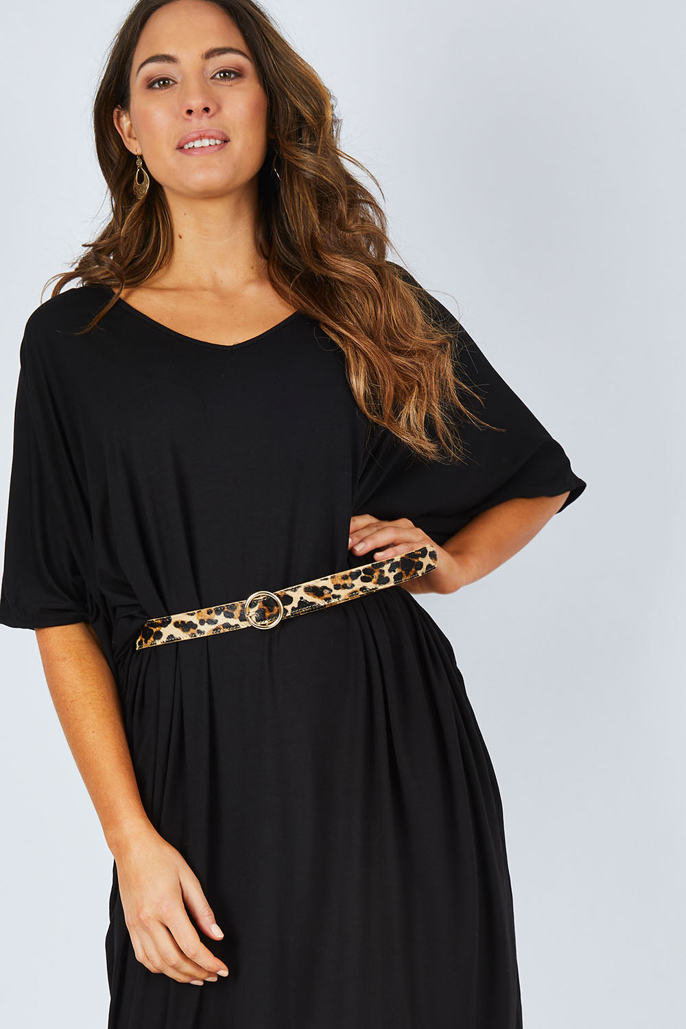 Model Madeline wearing size OneSize of the Maxi Miracle Dress in colour Black (Black), from the front, cropped image