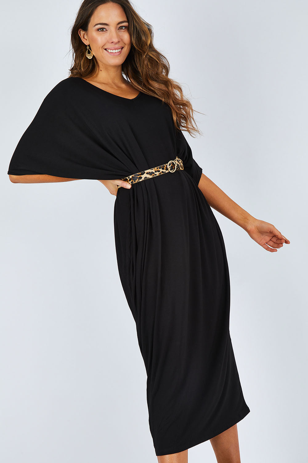 Model Madeline wearing size OneSize of the Maxi Miracle Dress in colour Black (Black), from the front, showing the whole outfit