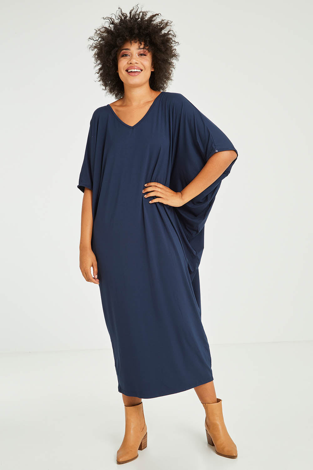 Model Olivia wearing size OneSize of the Maxi Miracle Dress in colour Navy (Blue), from the front, showing the whole outfit
