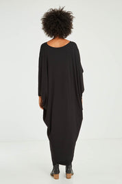 Model Olivia wearing size OneSize of the Long Sleeve Maxi Miracle Dress in colour Black (Black), from the back