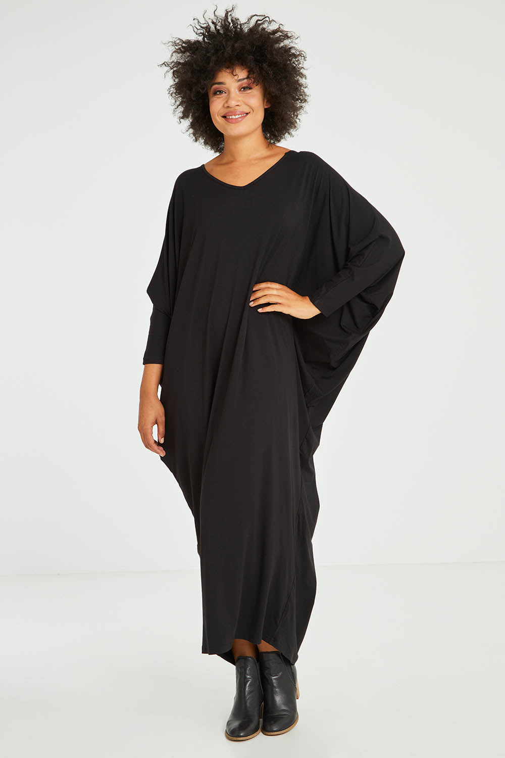 Model Olivia wearing size OneSize of the Long Sleeve Maxi Miracle Dress in colour Black (Black), from the front, showing the whole outfit