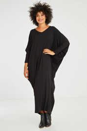Model Olivia wearing size OneSize of the Long Sleeve Maxi Miracle Dress in colour Black (Black), from the front, showing the whole outfit
