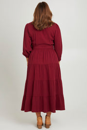 Model Monique wearing size L of the L/S Ruffle Wrap Dress in colour Mahogany (Pink), from the back