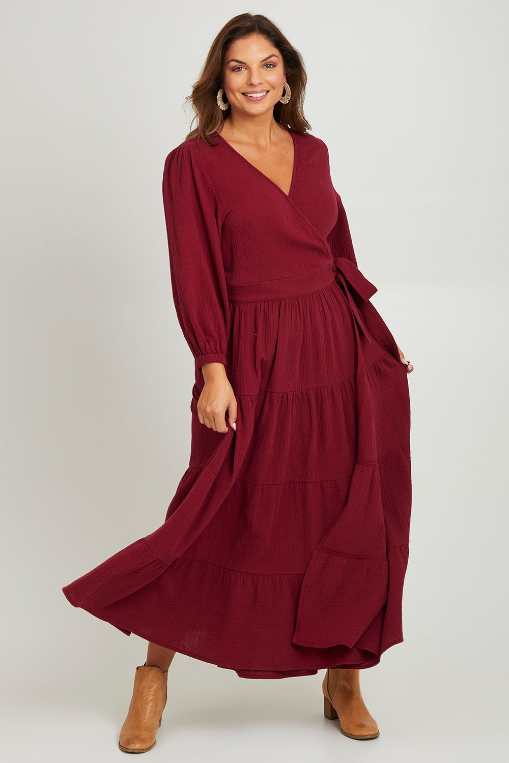Model Monique wearing size L of the L/S Ruffle Wrap Dress in colour Mahogany (Pink), from the front, showing the whole outfit