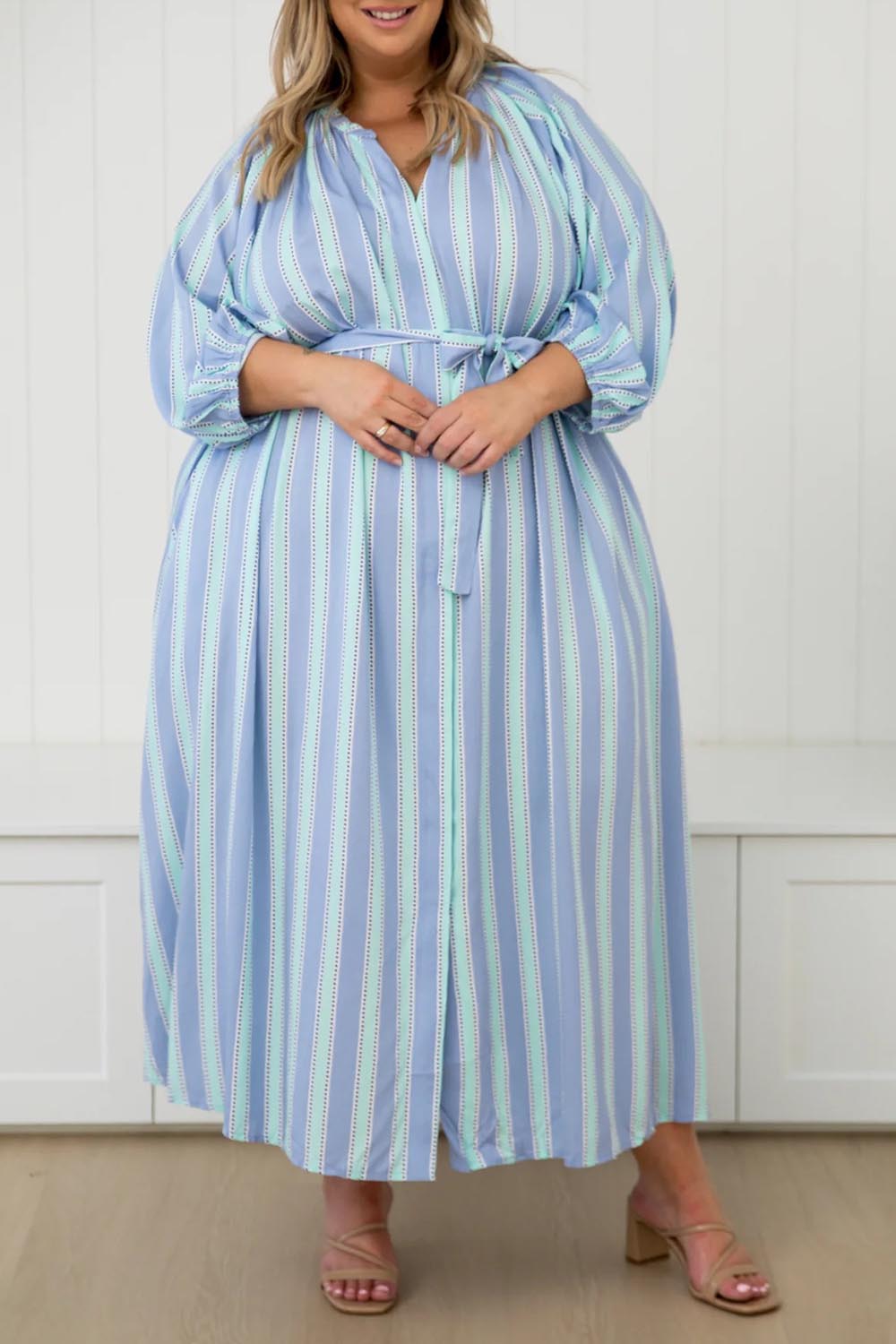 A model wearing the Athena Tencel Dress in colour Blue (Blue), from the front, cropped image