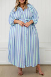 A model wearing the Athena Tencel Dress in colour Blue (Blue), from the front, cropped image