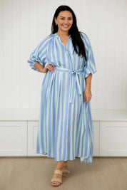 A model wearing the Athena Tencel Dress in colour Blue (Blue), from the front, showing the whole outfit