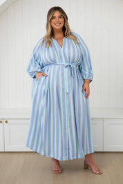 A model wearing the Athena Tencel Dress in colour Blue (Blue), from the front, showing the whole outfit