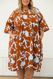 A model wearing the Kingsley Cotton Dress in colour Myrtle, from the front, cropped image
